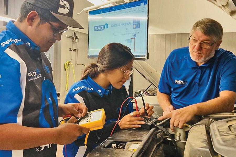 Three students working in their Mopar Chrysler Program at SJC!